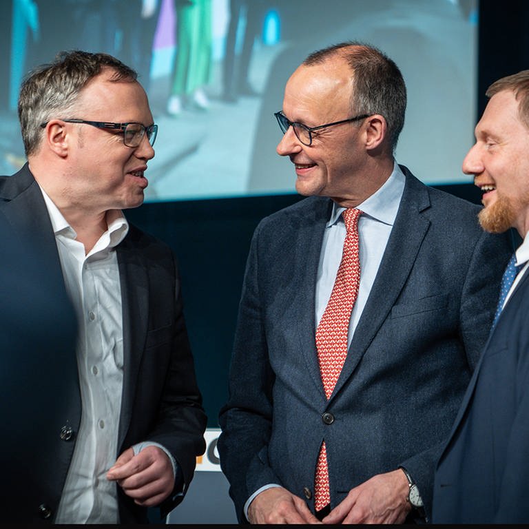 Mario Voigt, Friedrich Merz und Michael Kretschmer auf einer Programmkonferenz der CDU