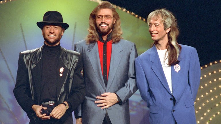 Die Band Bee Gees bei einem Auftritt 1991. Die Brüder Maurice, Barry und Robin Gibb (l-r).