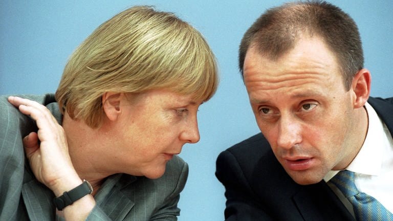 IMAGO  teamwork (Foto: imago images, Angela Merkel und Friedrich Merz am 21. Juni 2002)