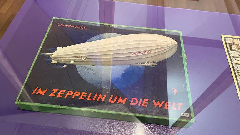 Seit dem Erstflug des Luftschiffs LZ1 am Bodensee wurden die Zeppeline auch in Würfelspielen vermarktet. 