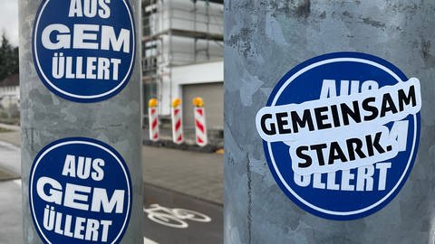 Der Streit um KSC-Vizepräsident Martin Müller ist auf Karlsruher Straßen sichtbar