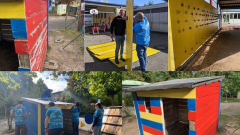 Freiwillige Helfer bauen eine Kletterwand ab, bohren Löcher und ersetzen Bretter in einem Spielhaus.  (Foto: privat)