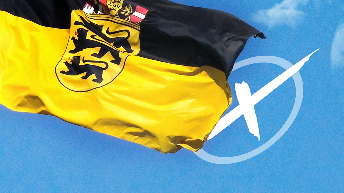 Eine Baden-Württemberg Flagge und ein Wahlkreuz