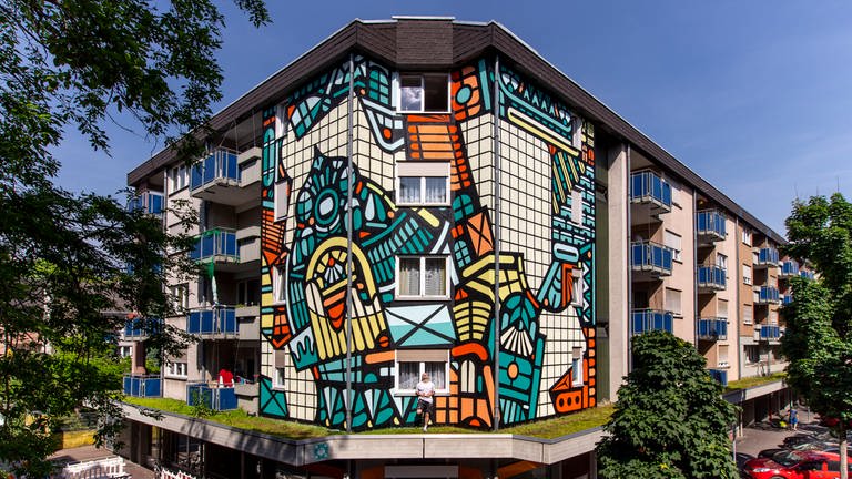 Mural von ISAKOV, 2021 – H 4, 9, 68159 Mannheim  Stadt.Wand.Kunst (Foto: Pressestelle, (c) Alexander Krziwanie / Stadt.Wand.Kunst)