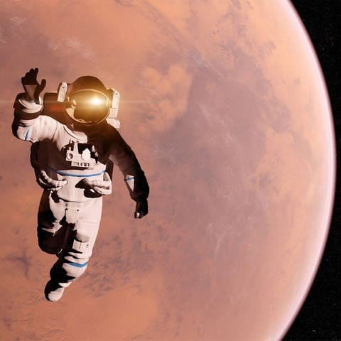 Illustration eines Astronauten vor dem Mars (Foto: IMAGO, imago images / Science Photo Library)