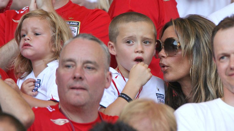 England squad s wives in Stuttgart Romeo, Brooklyn and Victoria Beckham right attend the English vs Ecuador match as part of the 2006 Worl Cup, in Stuttgart
