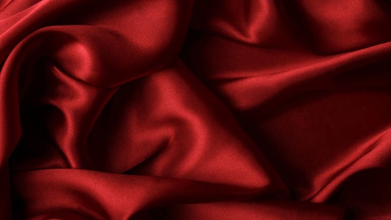 Red silk fabric (Foto: IMAGO, Zoonar)