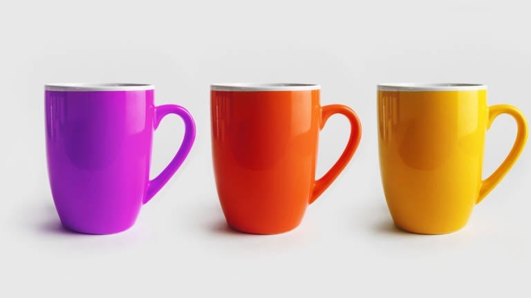 Three ceramic mugs Symbolfoto