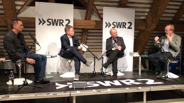 Christoph Schröder, Carsten Otte, Gregor Dotzauer und Martin Ebel bei der Diskussion