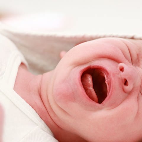 Portrait of crying baby  Symbolfoto