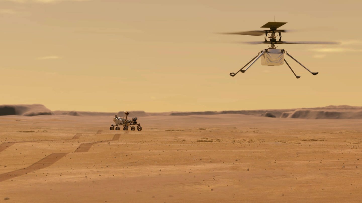 Illustration des NASA-Ingenuity-Mars-Hubschraubers im Flug, während der Perseverance-Rover wegrollt. Der Mars-Rover Perseverance ist am 18. Februar 2021 erfolgreich gelandet. Ingenuity ist  das erste Flugzeugn, das einen kontrollierten Flug auf einem anderen Planeten versucht. (Foto: IMAGO, IMAGO / ZUMA Wire)