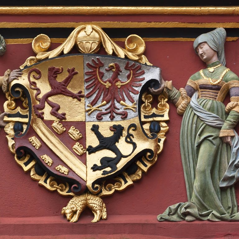 Habsburgisches Wappen am Historischen Kaufhaus (1520) in Freiburg: Der Ausdruck "Fisimatenten" geht u.a. auf einen Ausdruck aus der Heraldik zurück: Visamente. 
