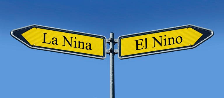  Zwei Wegweiser mit den Aufschriften "La Nina" und "El Nino" zeigen in unterschiedliche Richtungen. (Foto: IMAGO, IMAGO / Steinach)