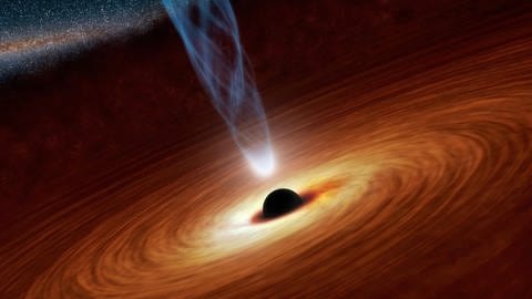 Die Abbildung zeigt ein supermassereiches Schwarzes Loch mit der millionen- bis milliardenfachen Masse unserer Sonne. Hier ist das supermassereiche Schwarze Loch in der Mitte von Materie umgeben, die in einer sogenannten Akkretionsscheibe auf das Schwarze Loch fließt. Diese Scheibe bildet sich, wenn Staub und Gas in der Galaxie auf das Loch fallen und von seiner Schwerkraft angezogen werden. (Foto: Image credit: NASA/JPL-Caltech)