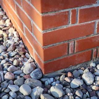 New paving stones along at the corner of the bricks house. Symbolfoto